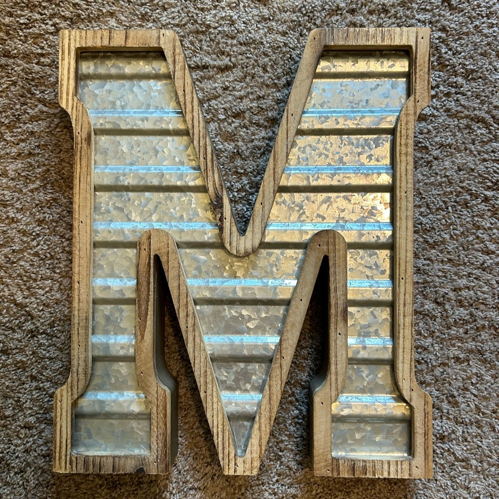 Metal and wood M wall decor